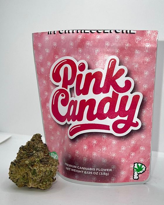 Bag of Pink Candy premium cannabis flower by Prolific with a 3.5g nug placed in front. Bright pink packaging with bold white and red logo.