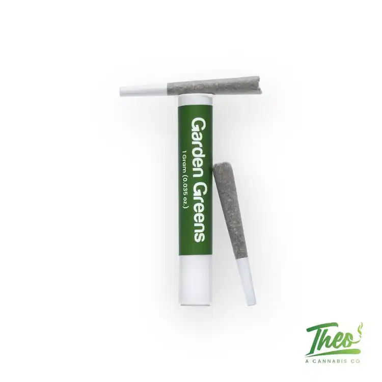 Flat lay of a green and white Garden Greens 1-gram pre-roll tube with two cannabis pre-rolls beside it, displayed on a clean white background with the Theo logo in the corner.
