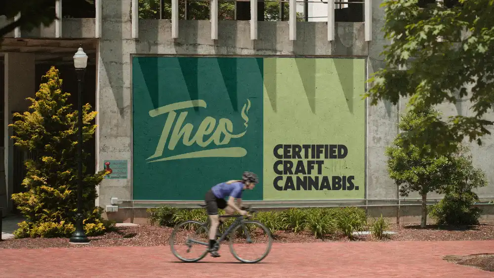 Billboard for Theo Cannabis Dispensary in Franklin Park, NJ showing 'Certified Craft Cannabis' with a cyclist riding past.