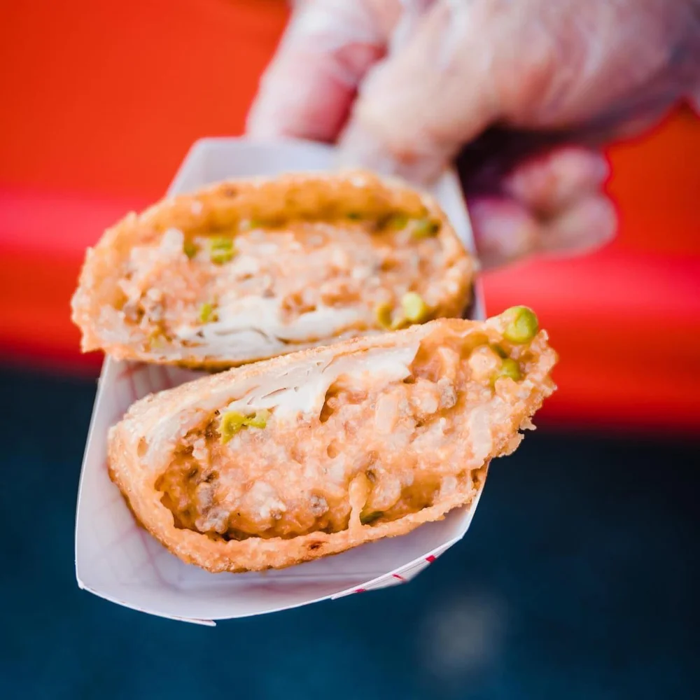 Close-up of a crispy gourmet egg roll from Rescue Rolls at Theo’s 4/20 Carnival in Franklin Park, NJ