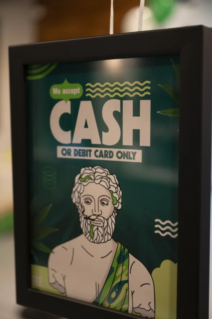 Cash or debit card only payment sign at Theo dispensary in Franklin Park, NJ on a guide about a first-time dispensary visit in Franklin Park, NJ