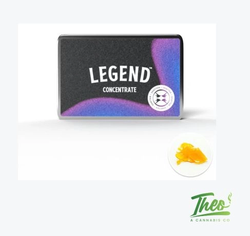 A sheet of Legend's Banana Tree shatter, translucent and amber-colored, displayed beside its dark packaging tin, cannabis concentrate available at Theo.